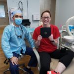 happy patient with invisalign aligners